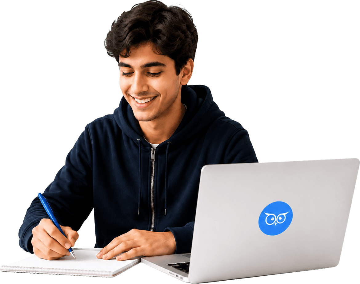 A smiling student writing notes beside a laptop during an online lesson
